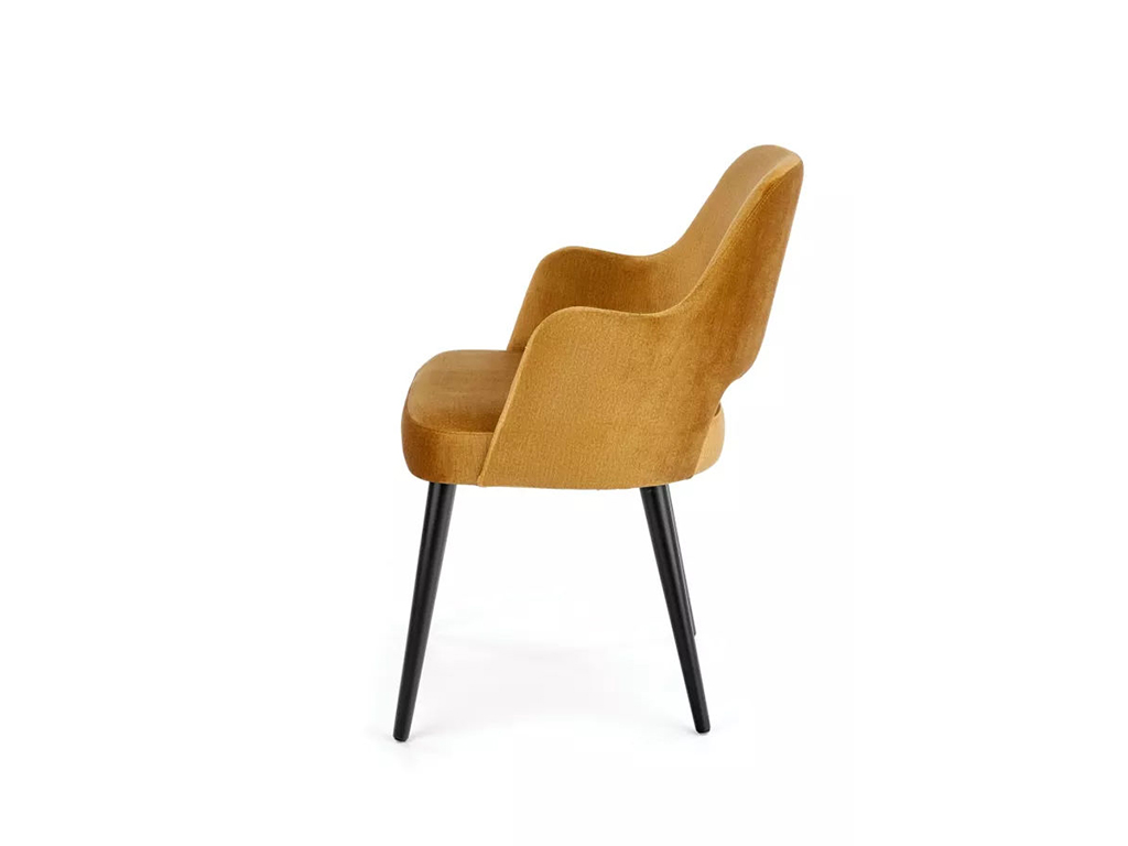 Pohled z profilu na židli MIREK 4 s měkkým čalouněním a elegantním zaobleným opěradlem, ideální do jídelny či obýváku.